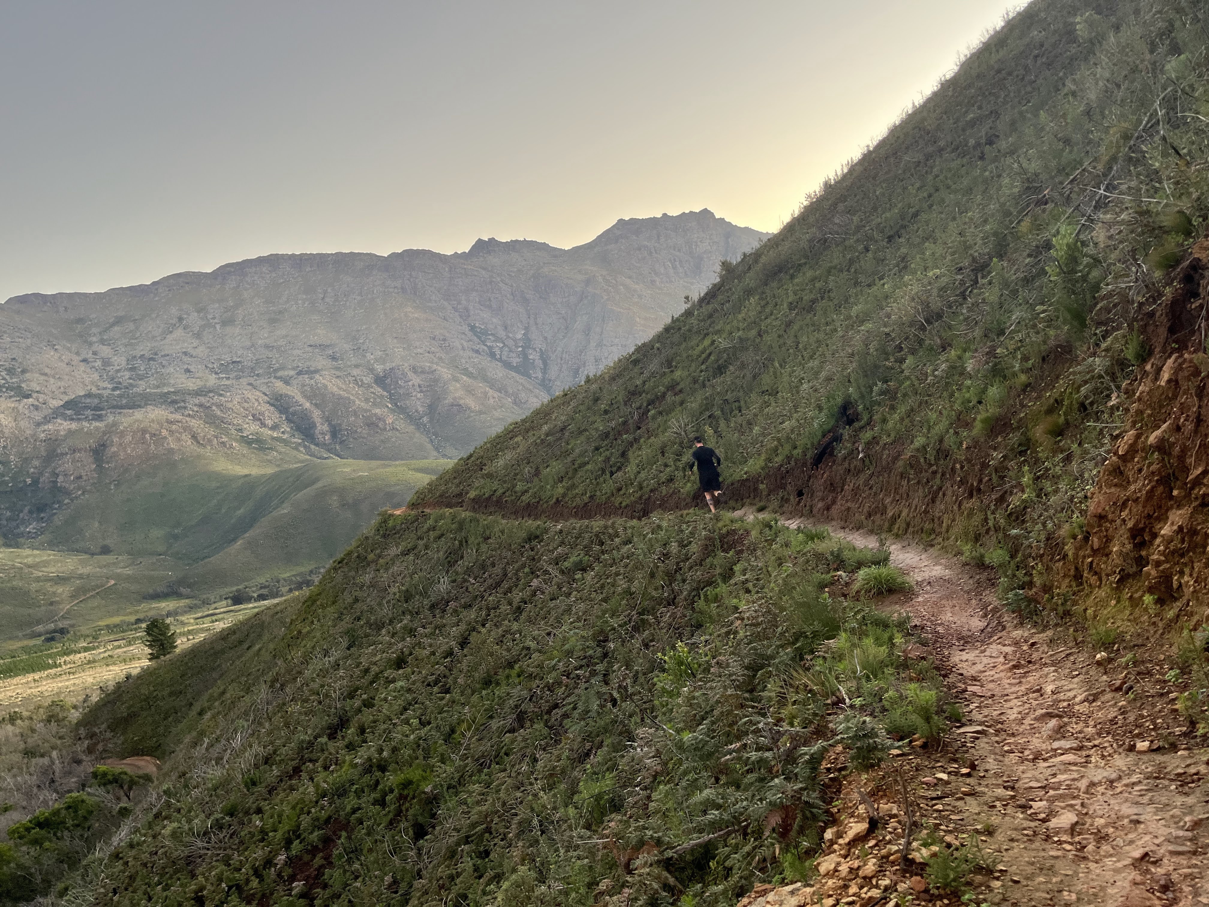 Hiker on the Stellenbosch mountain trail with valley views