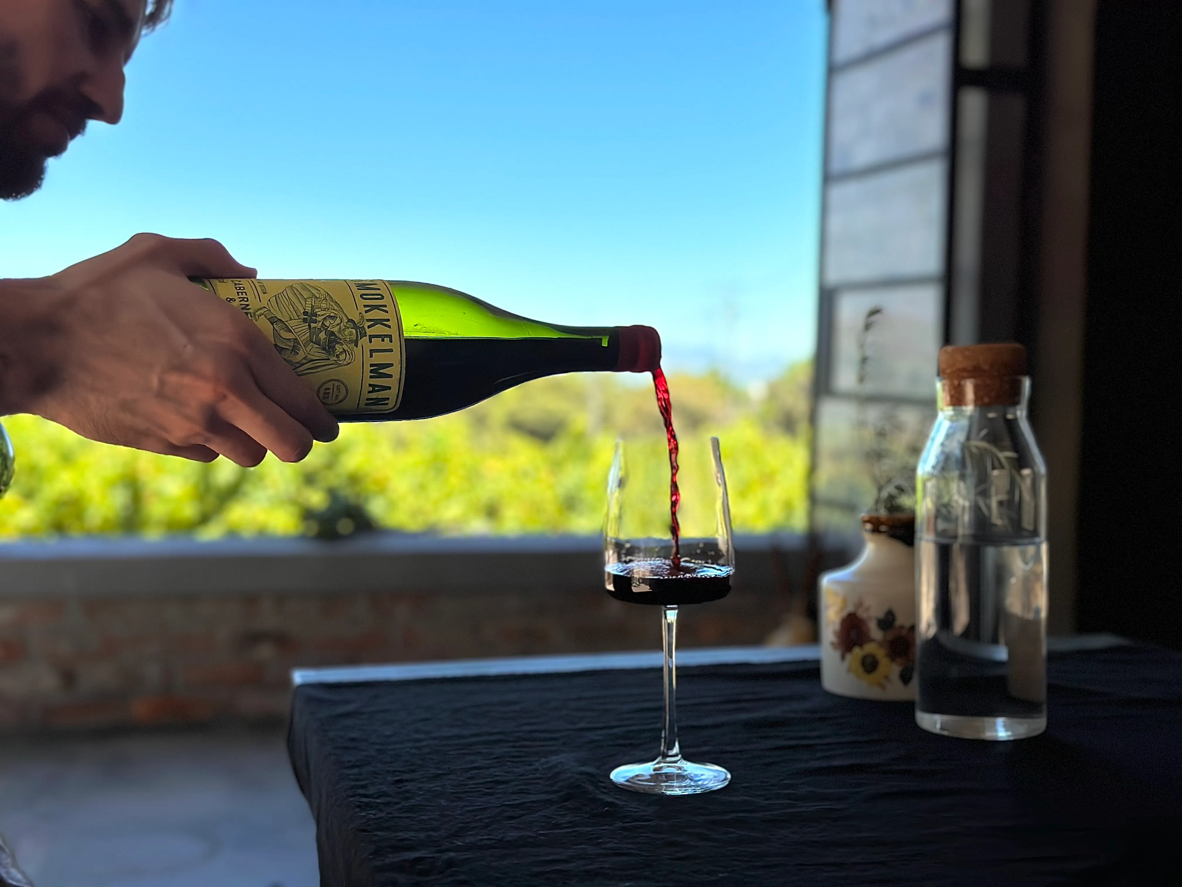 Wine being poured at a Stellenbosch estate
