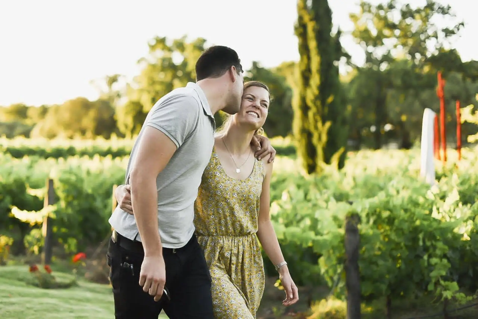 Couple embracing among the vineyards in the Cape Winelands